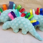 Plush dinosaurs with ribbons